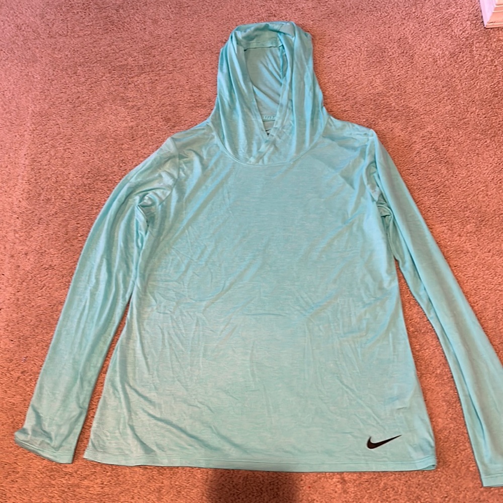 Nike woman’s long sleeved T-shirt with hood. Size Med. like new never worn.
